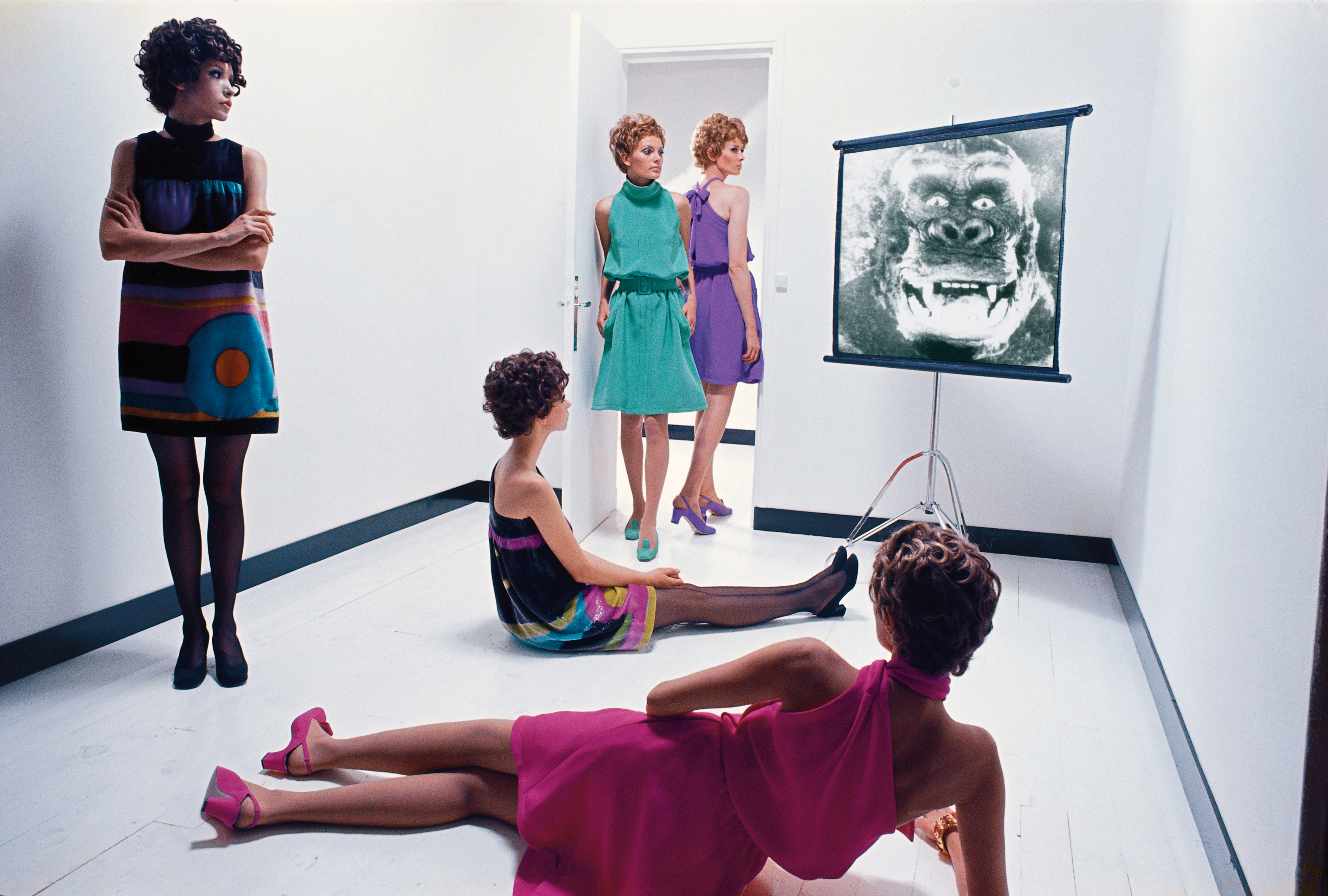 five models whatc a display with a monkey 